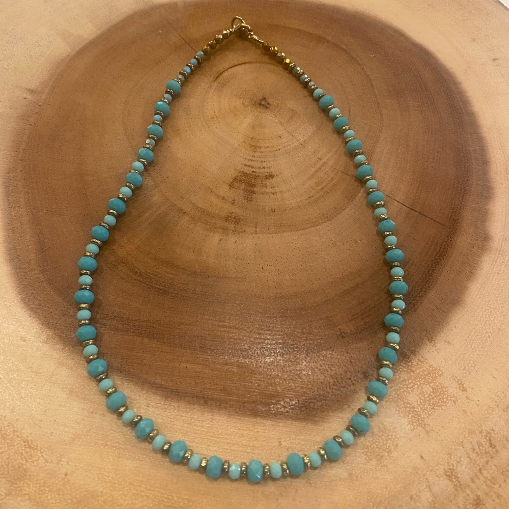 Handmade necklace with blue glass beads and gold tone accents -16.5” long